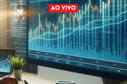Tela de computador exibe gráficos financeiros ao vivo, com linhas e barras indicando dados do mercado em tempo real.