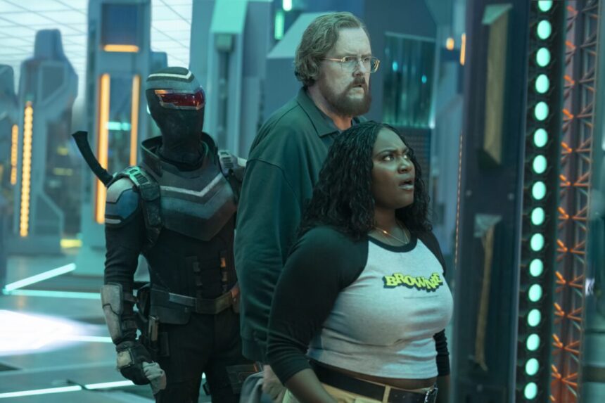 Vigilante, Economos and Adebayo stand in the extradimensional room on Peacemaker Season 2 Episode 6,