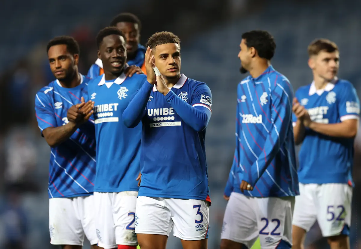 Max Aarons applauds the Rangers fans at the end of a game