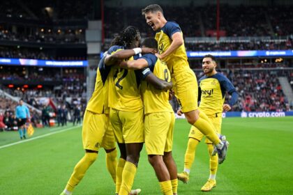 Promise David celebrates with team-mates after scoring for Union Saint-Gilloise against PSV in the Champions League