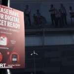 A sign outside the stadium asking fans to have their digital ticket ready