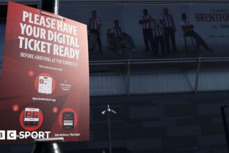 A sign outside the stadium asking fans to have their digital ticket ready