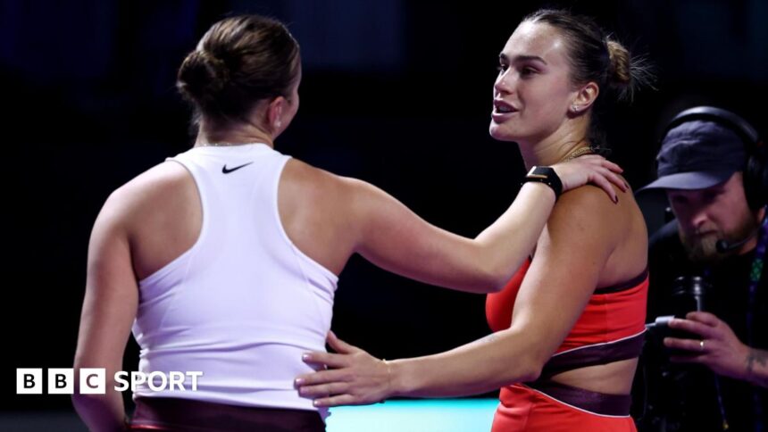 Aryna Sabalenka and Amanda Anisimova embrace at the net after their match