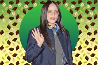 Billie Eilish waving in front of a graphic background with chocolate and pistachio illustrations