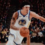 Na imagem, Gui Santos correndo e armando a jogada para o Golden State Warriors.