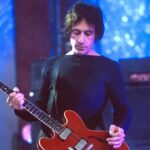 The Cure’s Perry Bamonte performing onstage in 2000