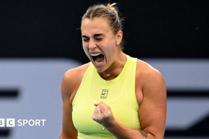 Aryna Sabalenka celebrates with a clenched fist