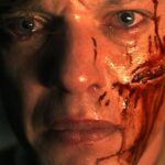 a young henry or vecna opening the briefcase he finds in stranger things 5 the finale