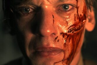 a young henry or vecna opening the briefcase he finds in stranger things 5 the finale