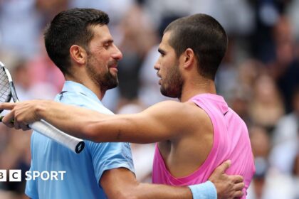 Novak Djokovic and Carlos Alcaraz embrace after their 2025 US Open quarter-final